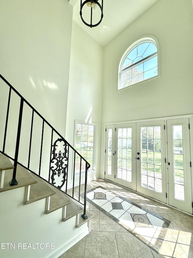 11709 Black Powder Dr, Knoxville, TN 37934 - foyer entrance with french doors, a high ceiling, and stairs