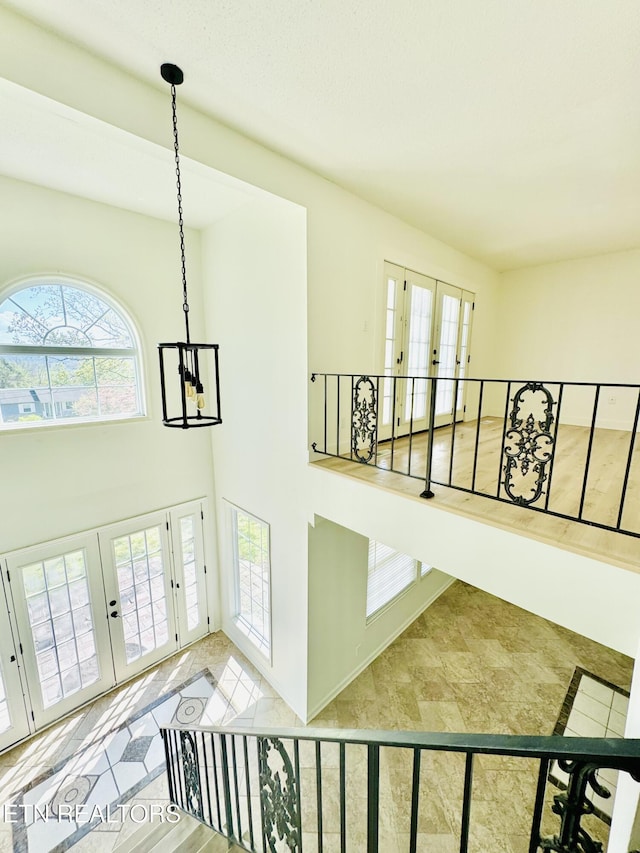 11709 Black Powder Dr, Knoxville, TN 37934 - stairs featuring a chandelier, plenty of natural light, and french doors