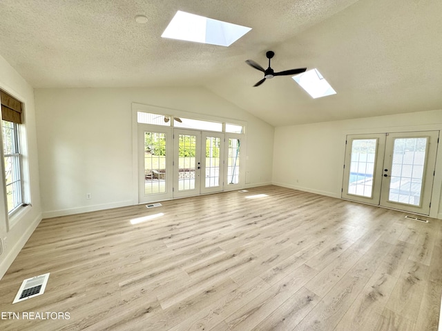 11709 Black Powder Dr, Knoxville, TN 37934 - unfurnished living room with french doors, visible vents, and a wealth of natural light