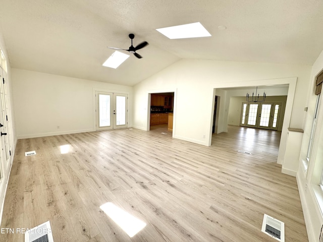 11709 Black Powder Dr, Knoxville, TN 37934 - unfurnished living room with lofted ceiling with skylight, visible vents, a wealth of natural light, and ceiling fan