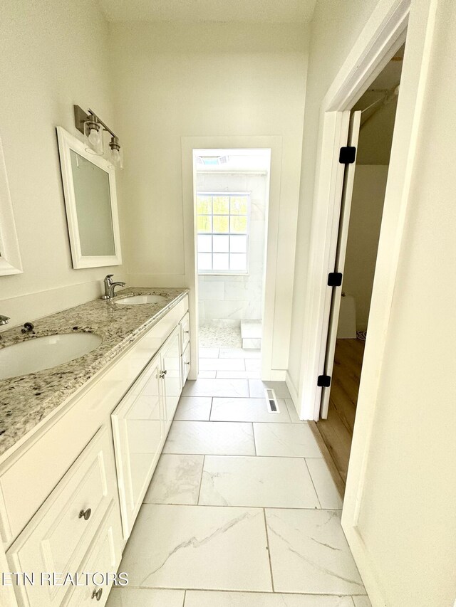11709 Black Powder Dr, Knoxville, TN 37934 - full bath with walk in shower, marble finish floor, a sink, and double vanity