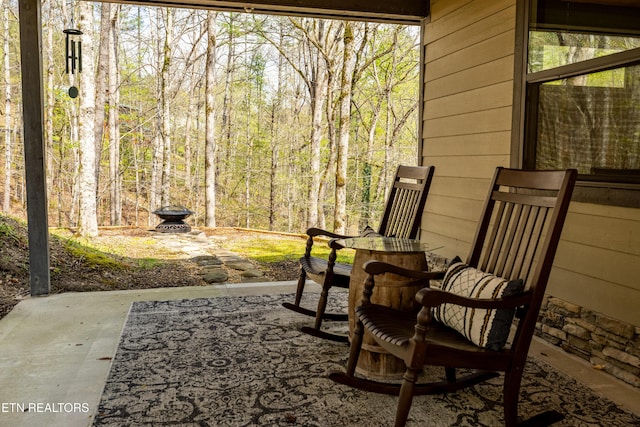 view of patio / terrace with a view of trees