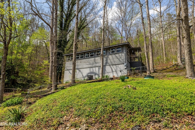 view of outdoor structure with a view of trees