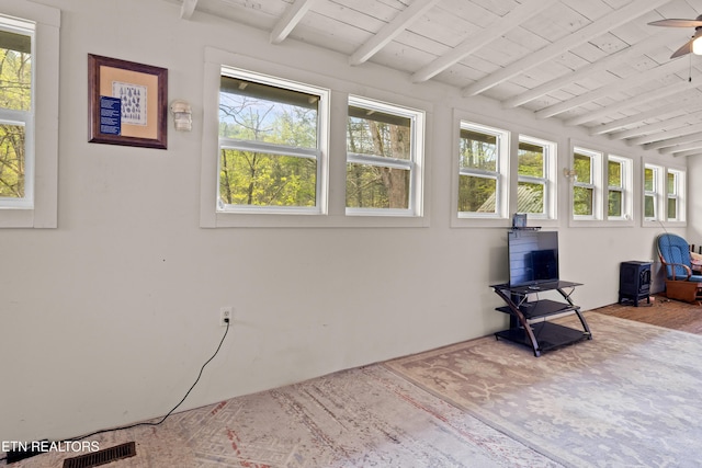 sunroom / solarium with beamed ceiling and visible vents