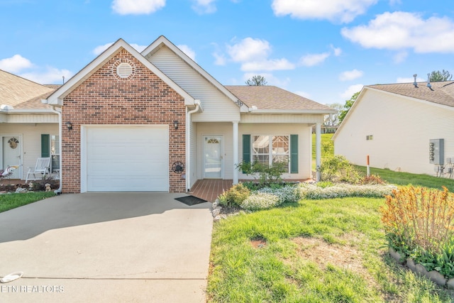300 Willington Pl, Loudon, TN 37774 - view of front of property with brick siding, driveway, roof with shingles, and a garage