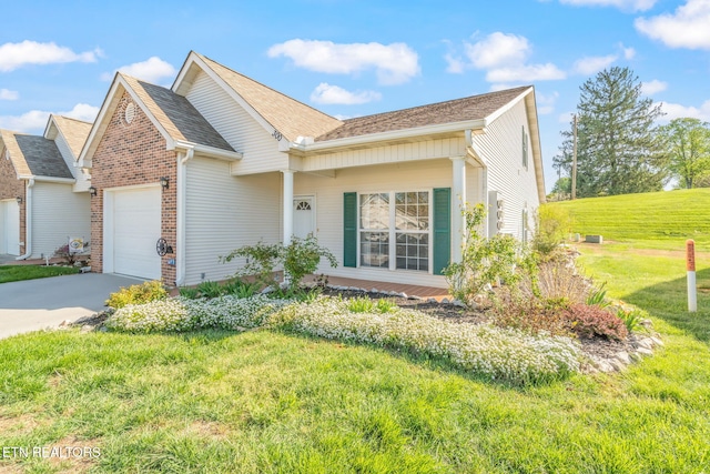 300 Willington Pl, Loudon, TN 37774 - ranch-style home featuring brick siding, a front lawn, driveway, and a garage