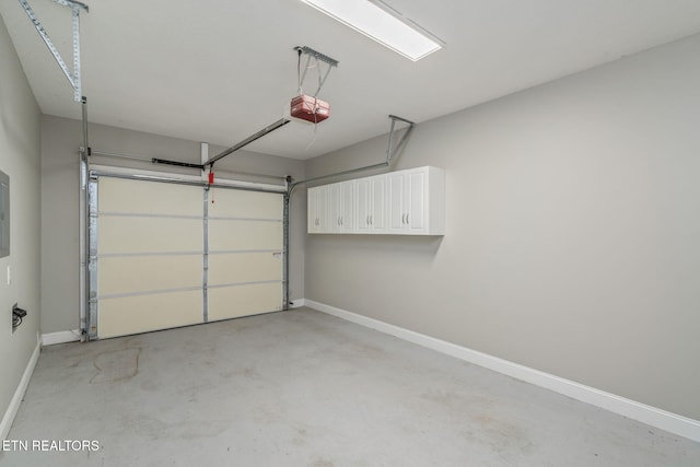 300 Willington Pl, Loudon, TN 37774 - garage featuring baseboards and a garage door opener