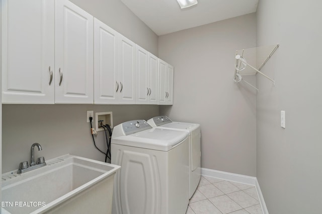 300 Willington Pl, Loudon, TN 37774 - clothes washing area with a sink, light tile patterned flooring, washer and dryer, cabinet space, and baseboards