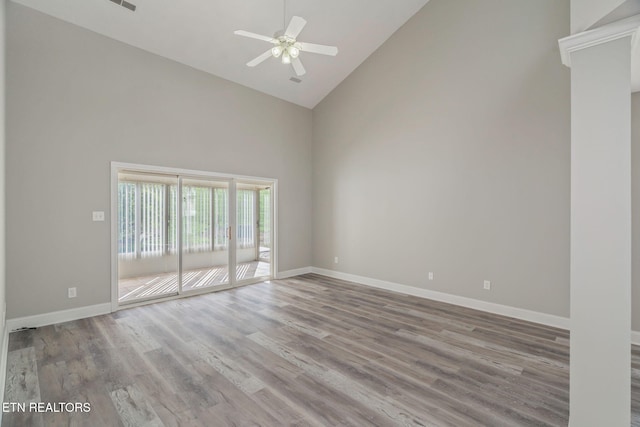 300 Willington Pl, Loudon, TN 37774 - empty room featuring high vaulted ceiling, baseboards, a ceiling fan, and wood finished floors