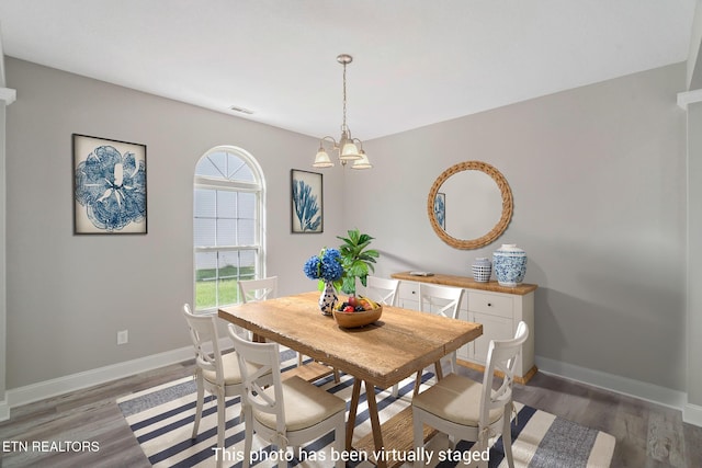 300 Willington Pl, Loudon, TN 37774 - dining room with baseboards, a notable chandelier, visible vents, and light wood finished floors