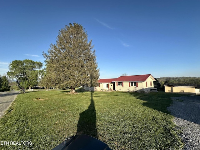 ranch-style home with a front yard