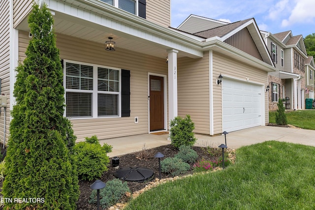 entrance to property featuring a shingled roof, an attached garage, concrete driveway, and a porch