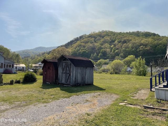 view of shed with a mountain view
