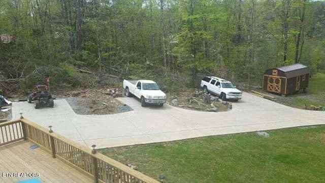 694 Lake Ln, New Tazewell, TN 37825 - view of yard featuring a forest view and a wooden deck