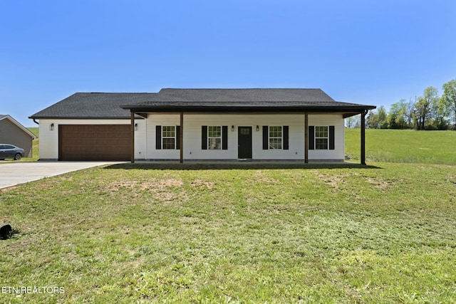 252 Old Middlesboro Hwy, Lafollette, TN 37766 - view of front of house featuring driveway, a front yard, covered porch, and a garage