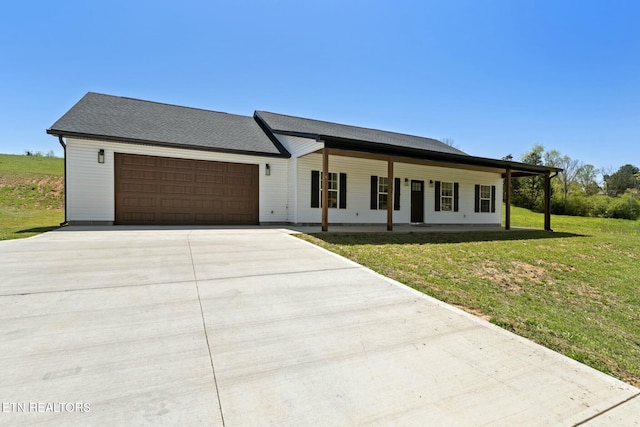 252 Old Middlesboro Hwy, Lafollette, TN 37766 - modern inspired farmhouse featuring an attached garage, covered porch, a front yard, and concrete driveway