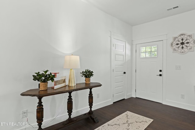 252 Old Middlesboro Hwy, Lafollette, TN 37766 - entrance foyer with visible vents, baseboards, and dark wood-style flooring
