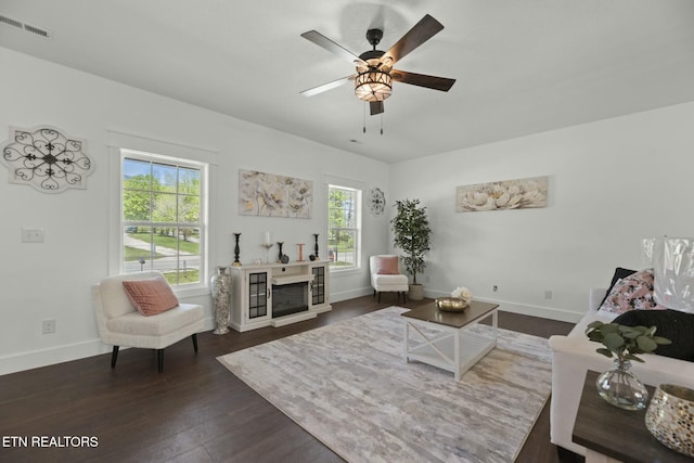 252 Old Middlesboro Hwy, Lafollette, TN 37766 - living area featuring a ceiling fan, visible vents, dark wood finished floors, and a healthy amount of sunlight