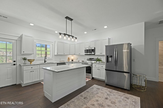 252 Old Middlesboro Hwy, Lafollette, TN 37766 - kitchen with white cabinets, stainless steel appliances, and visible vents