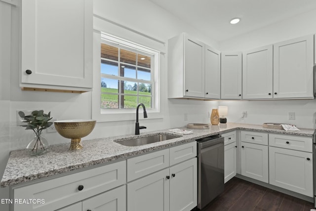 252 Old Middlesboro Hwy, Lafollette, TN 37766 - kitchen with light stone countertops, stainless steel dishwasher, a sink, and white cabinetry