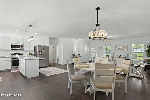 252 Old Middlesboro Hwy, Lafollette, TN 37766 - dining space with baseboards, dark wood-style flooring, a chandelier, and recessed lighting