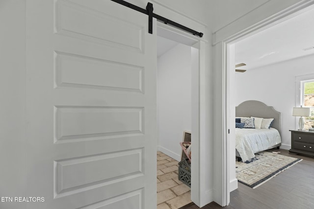 252 Old Middlesboro Hwy, Lafollette, TN 37766 - bedroom with a barn door, baseboards, and visible vents