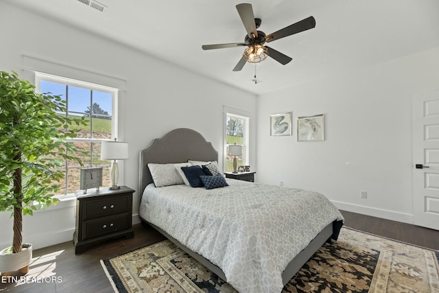252 Old Middlesboro Hwy, Lafollette, TN 37766 - bedroom with visible vents, baseboards, and dark wood-style floors