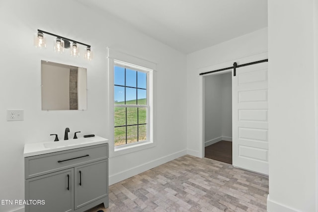 252 Old Middlesboro Hwy, Lafollette, TN 37766 - bathroom featuring brick floor, baseboards, and vanity