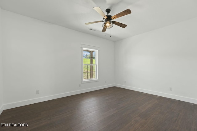 252 Old Middlesboro Hwy, Lafollette, TN 37766 - empty room featuring visible vents, a ceiling fan, baseboards, and dark wood-style flooring