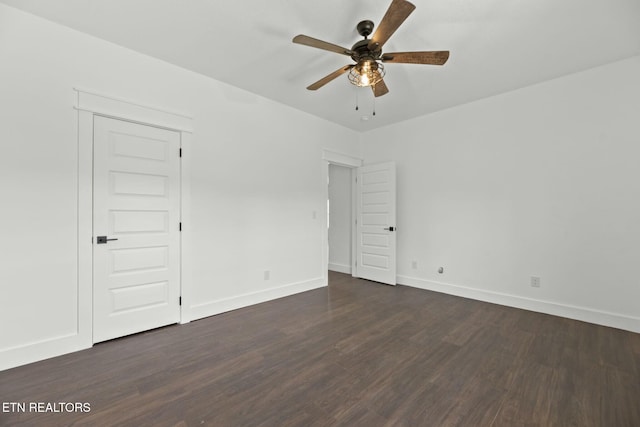 252 Old Middlesboro Hwy, Lafollette, TN 37766 - unfurnished bedroom featuring a ceiling fan, baseboards, and dark wood finished floors