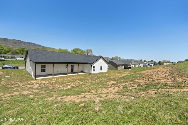 252 Old Middlesboro Hwy, Lafollette, TN 37766 - back of property featuring a patio area, a yard, and a mountain view