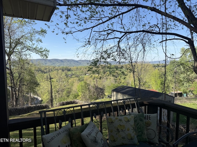 view of mountain feature with a view of trees