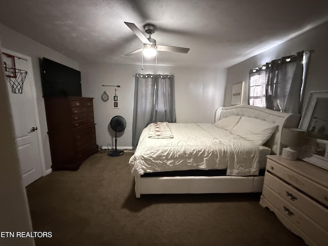 bedroom with ceiling fan, baseboards, and carpet flooring