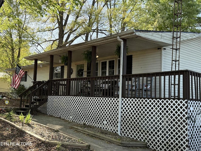 wooden deck featuring covered porch
