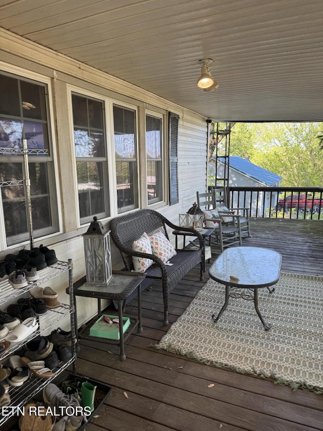 wooden terrace featuring a porch
