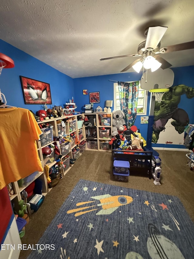 interior space featuring carpet floors, a textured ceiling, and ceiling fan