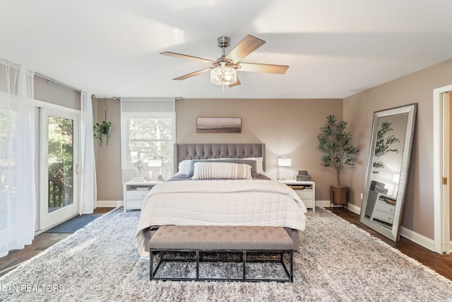 bedroom with wood finished floors, baseboards, ceiling fan, and access to exterior