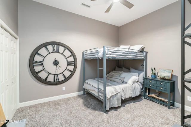 bedroom with carpet floors, a closet, visible vents, and baseboards