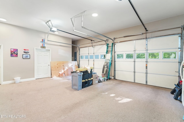 garage featuring electric panel and a garage door opener