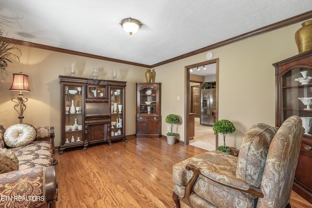46 Chestnut Dr, Norris, TN 37828 - living area featuring crown molding, wood finished floors, and a textured ceiling