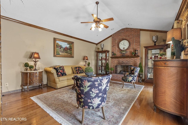 46 Chestnut Dr, Norris, TN 37828 - living area with a ceiling fan, wood finished floors, a fireplace, lofted ceiling, and ornamental molding