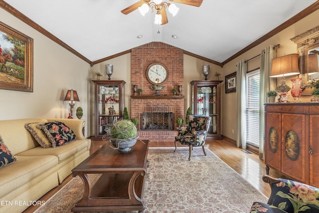46 Chestnut Dr, Norris, TN 37828 - living area with crown molding, a ceiling fan, wood finished floors, lofted ceiling, and a brick fireplace