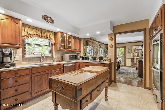 46 Chestnut Dr, Norris, TN 37828 - kitchen featuring light countertops, backsplash, stainless steel appliances, and a sink