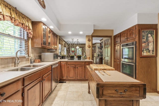 46 Chestnut Dr, Norris, TN 37828 - kitchen with tasteful backsplash, a sink, glass insert cabinets, stainless steel appliances, and recessed lighting