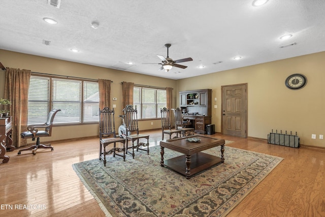 46 Chestnut Dr, Norris, TN 37828 - living room with visible vents, a ceiling fan, baseboards, and light wood-style flooring