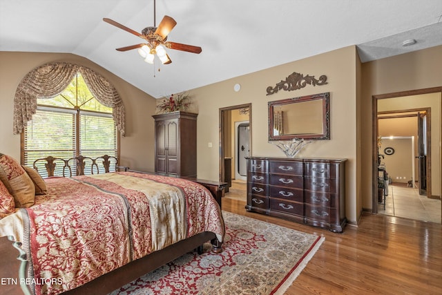 46 Chestnut Dr, Norris, TN 37828 - bedroom with vaulted ceiling, light wood finished floors, and a ceiling fan