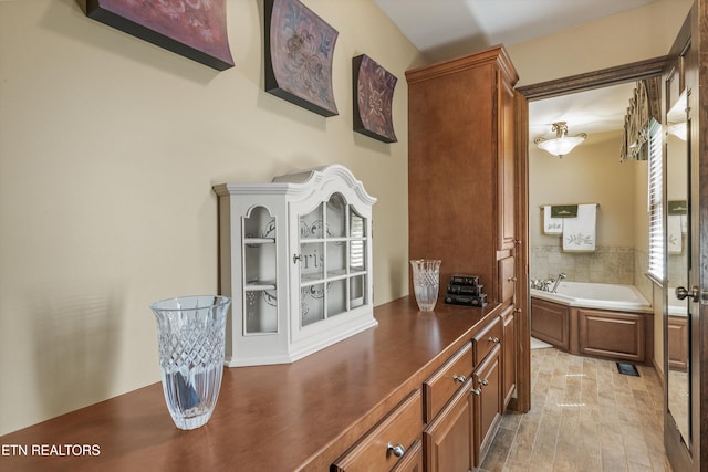 46 Chestnut Dr, Norris, TN 37828 - full bathroom featuring a bath and wood finished floors