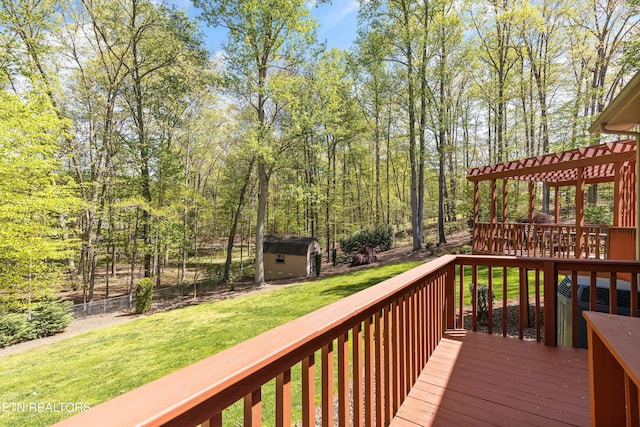 46 Chestnut Dr, Norris, TN 37828 - wooden terrace with a pergola, a lawn, an outdoor structure, fence, and a storage unit