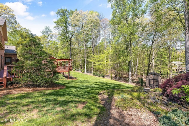 46 Chestnut Dr, Norris, TN 37828 - view of yard with an outdoor structure, a shed, and a deck