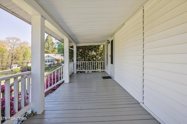 wooden terrace featuring a porch